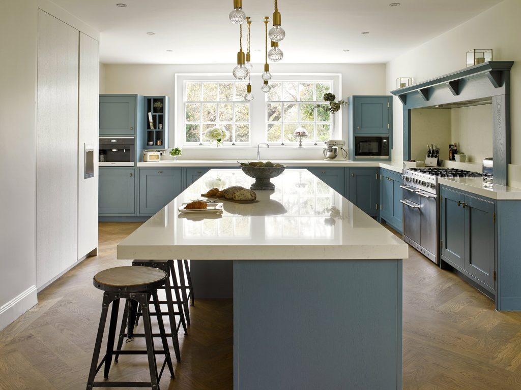 Shaker style Blue Kitchen with streamlined handleless cabinetry