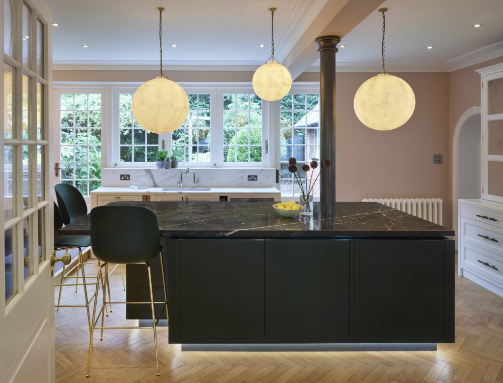Green Painted Kitchen with traditional handleless island and carrara marble worktop