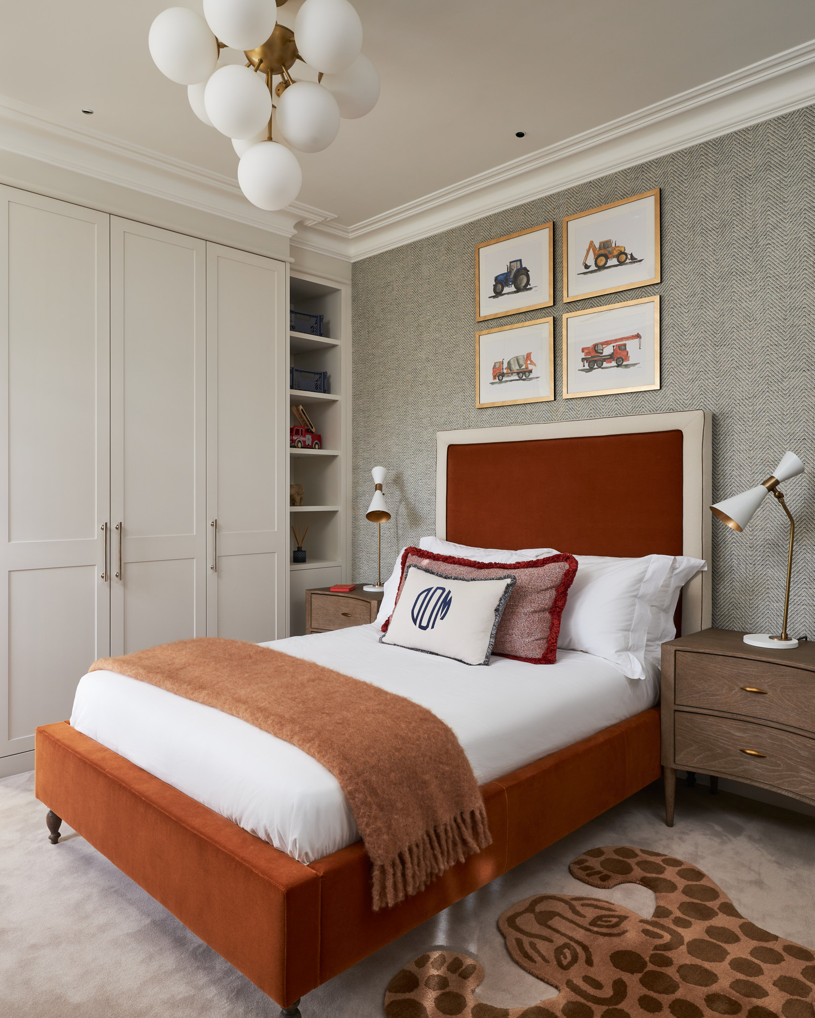 An elegant child's bedroom incorporating simple 2 panel Shaker hand painted wardrobes. Built to the ceiling with the plaster room coving running around the face of the furniture and finished in Little Greene Slaked Lime 149 Mid paint.