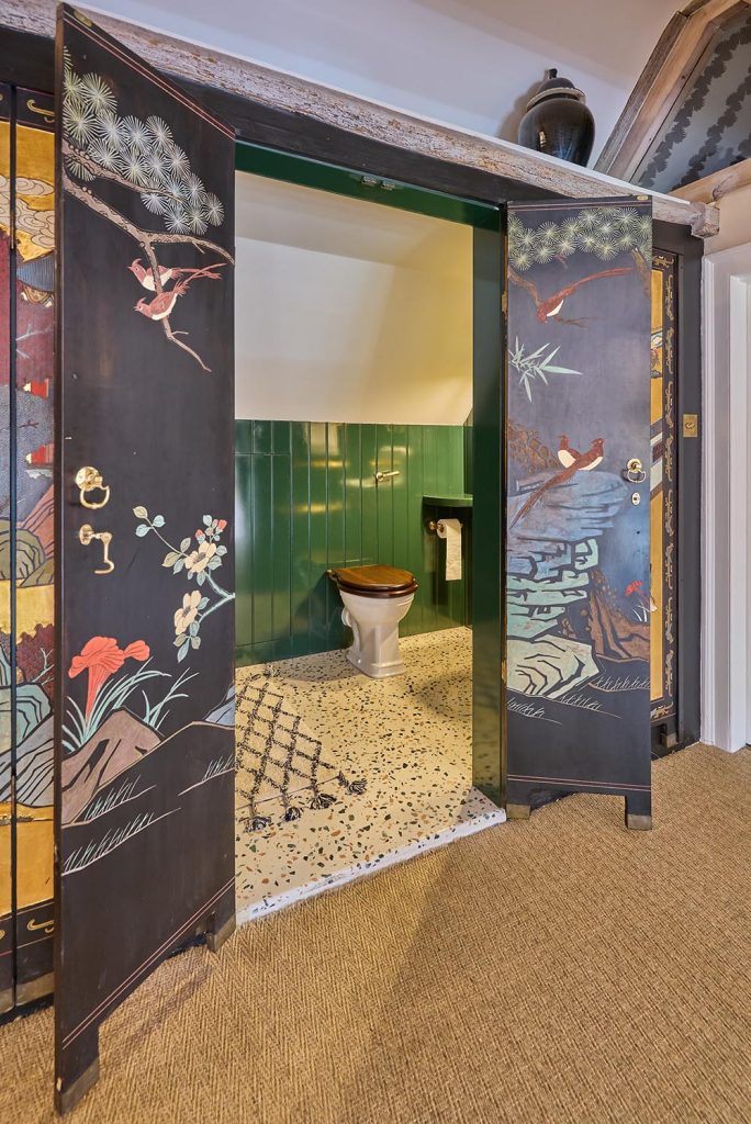 Bespoke Bathroom featuring antique artwork of Chinese screens.